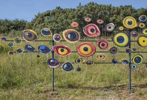 A close up of the Jenny Kendler artwork which shows a number of different eye artworks set on an iron frame